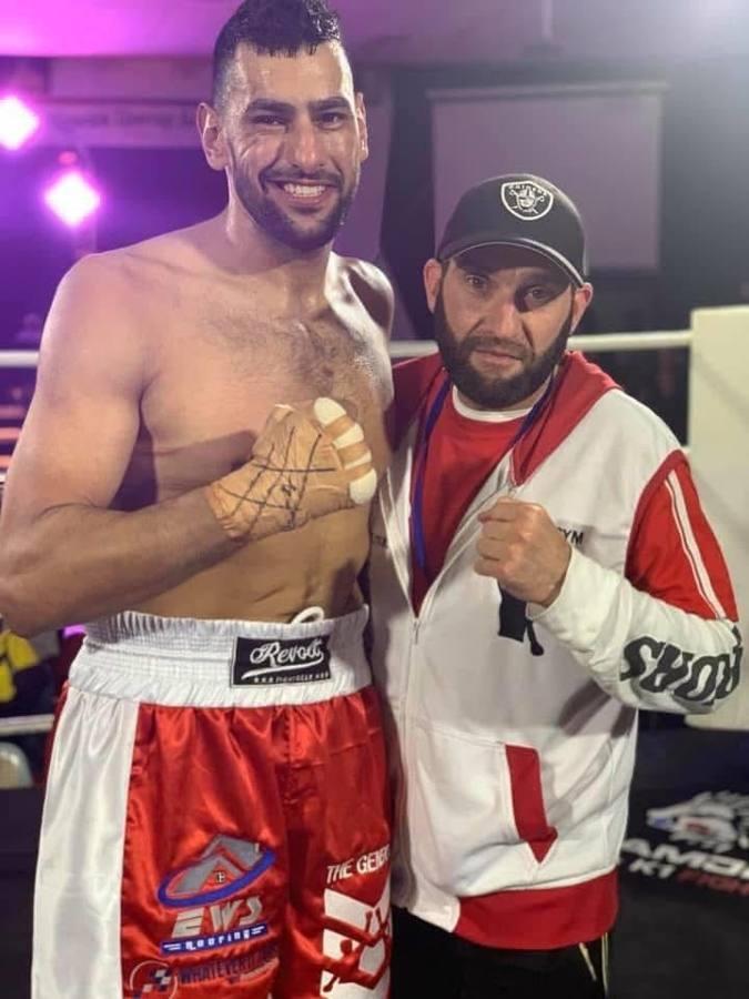 Coach and fighter after the win
