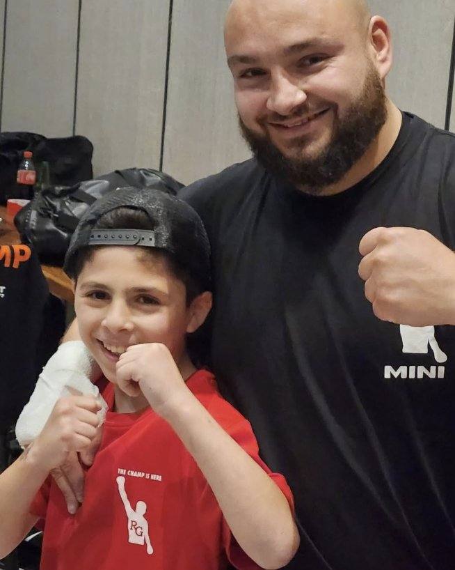 Mini Nachar with a young boxer