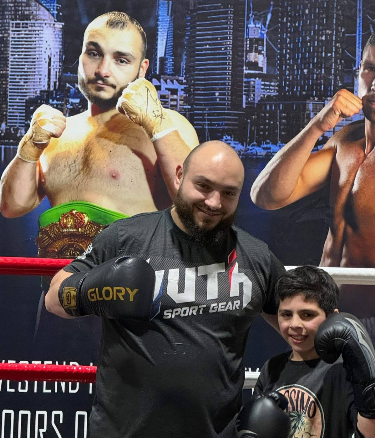 Mini Nachar in the ring with a young boxer